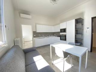 soggiorno con angolo cottura