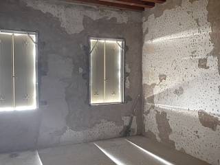 Dettaglio intonaco picchiettato