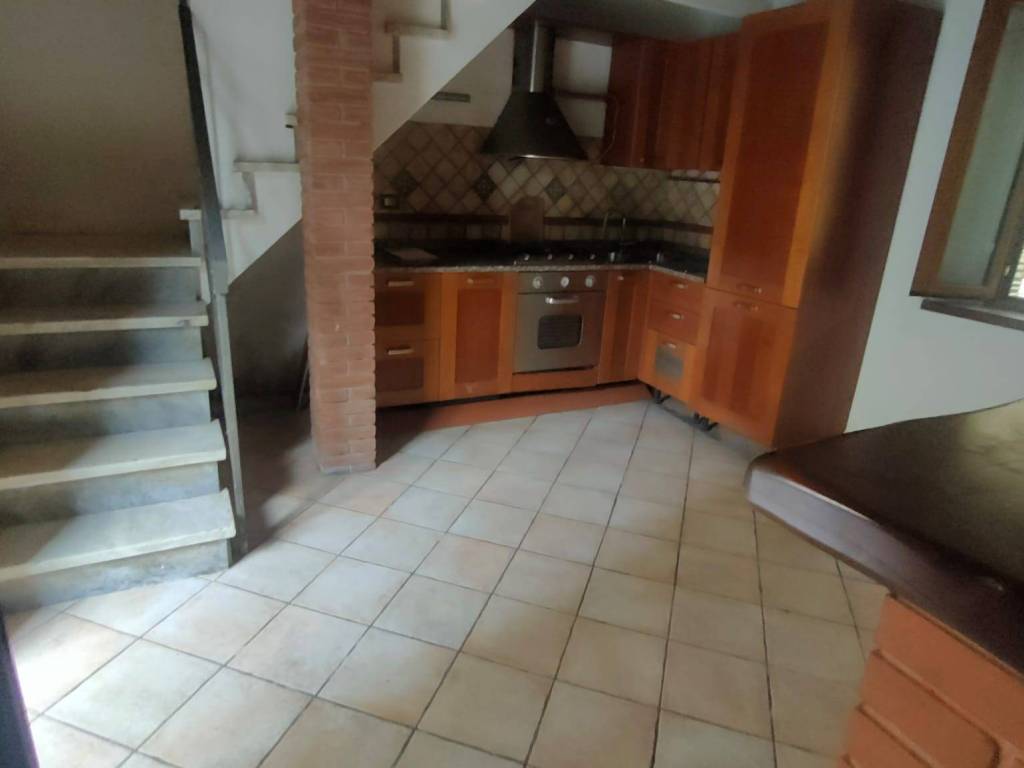 sala con cucina a vista