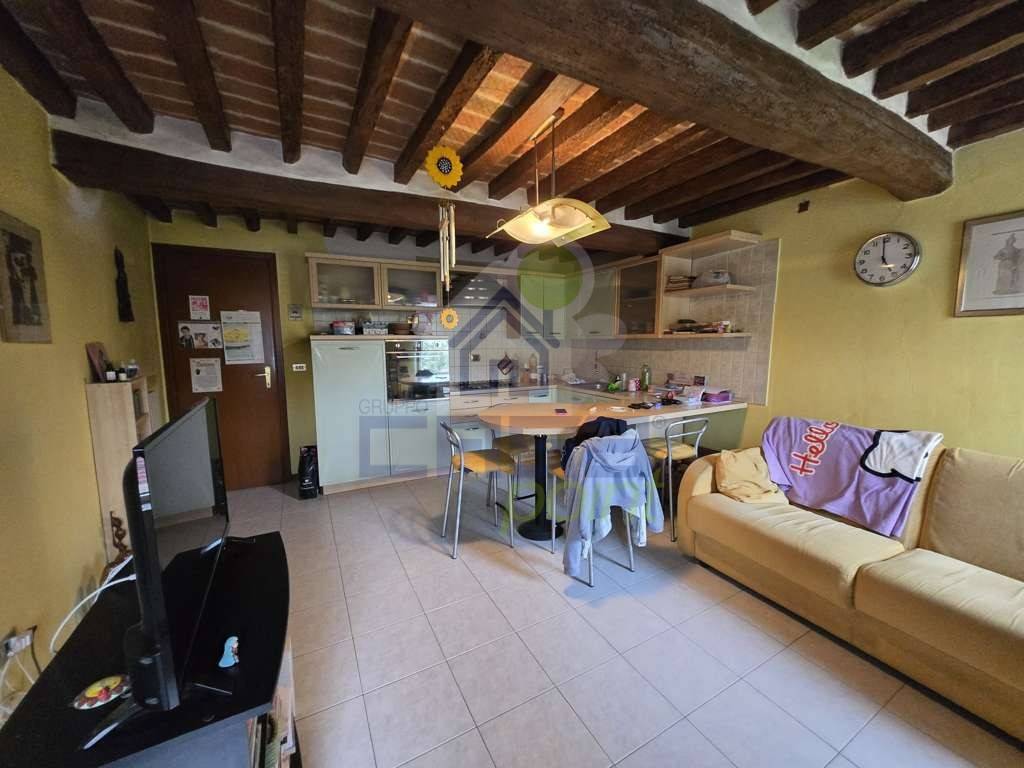 sala con cucina a vista